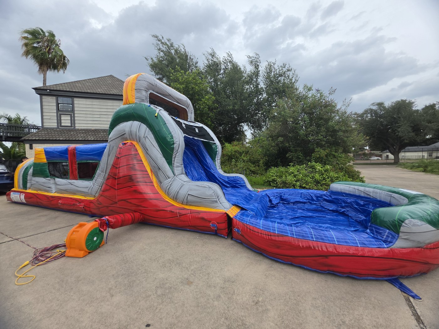 Marble Rush wet setup — obstacle course with slide and splash pool
